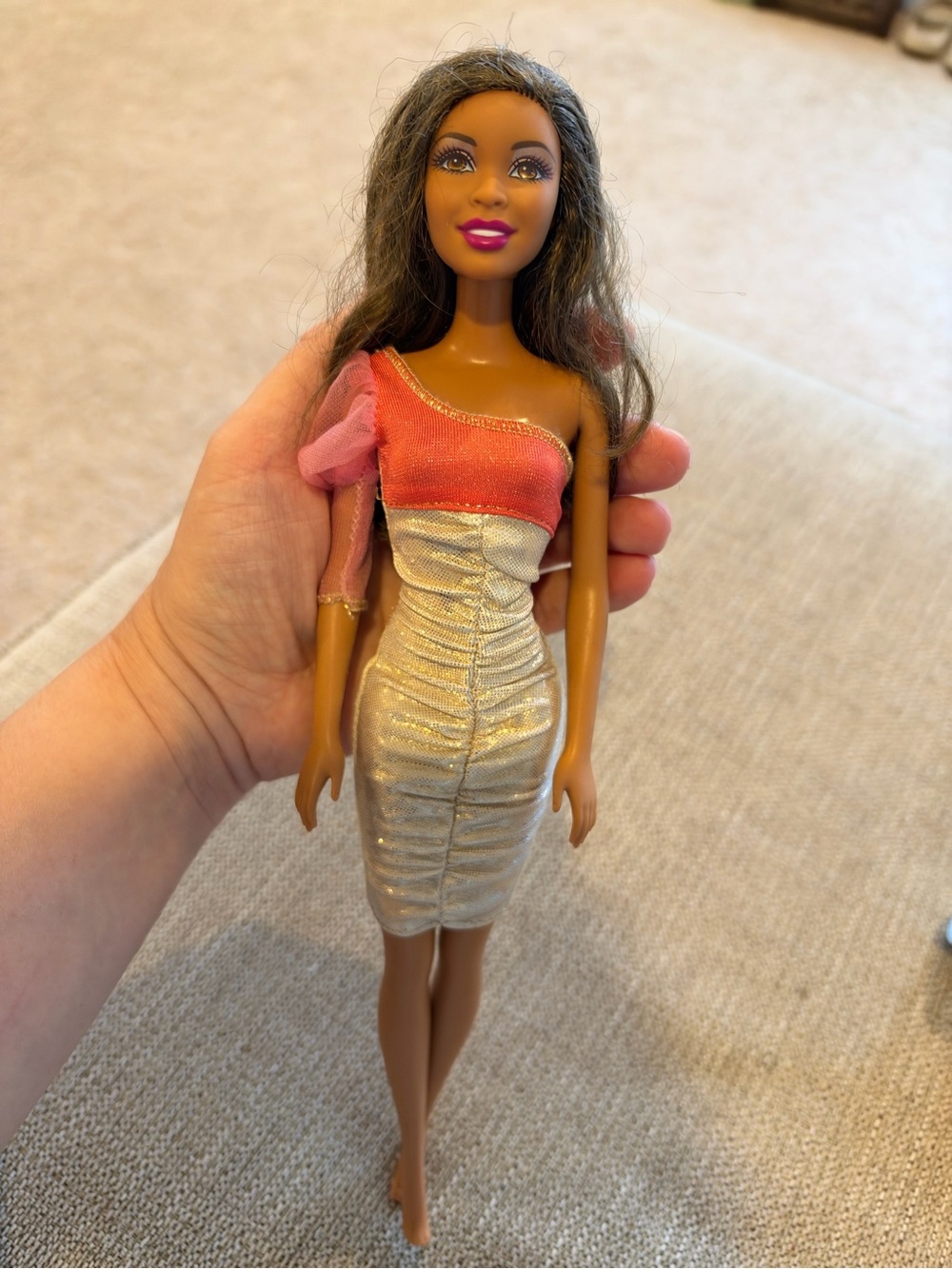 Barbie with brown hair and golden dress